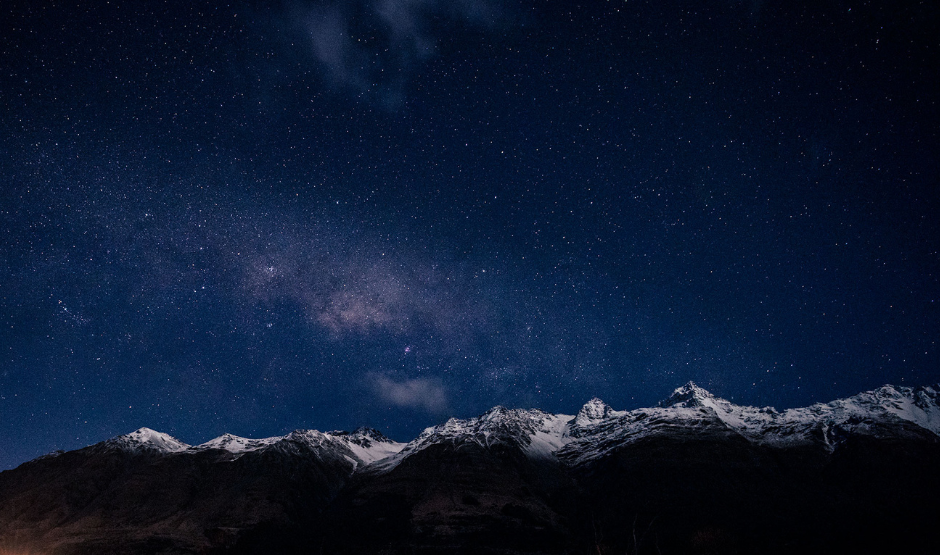 Snow capped mountains in New Zealand with Milky Way above.